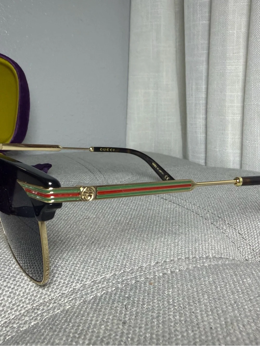 Gucci Black Lensed Sunglasses with Gold-Tone Frame